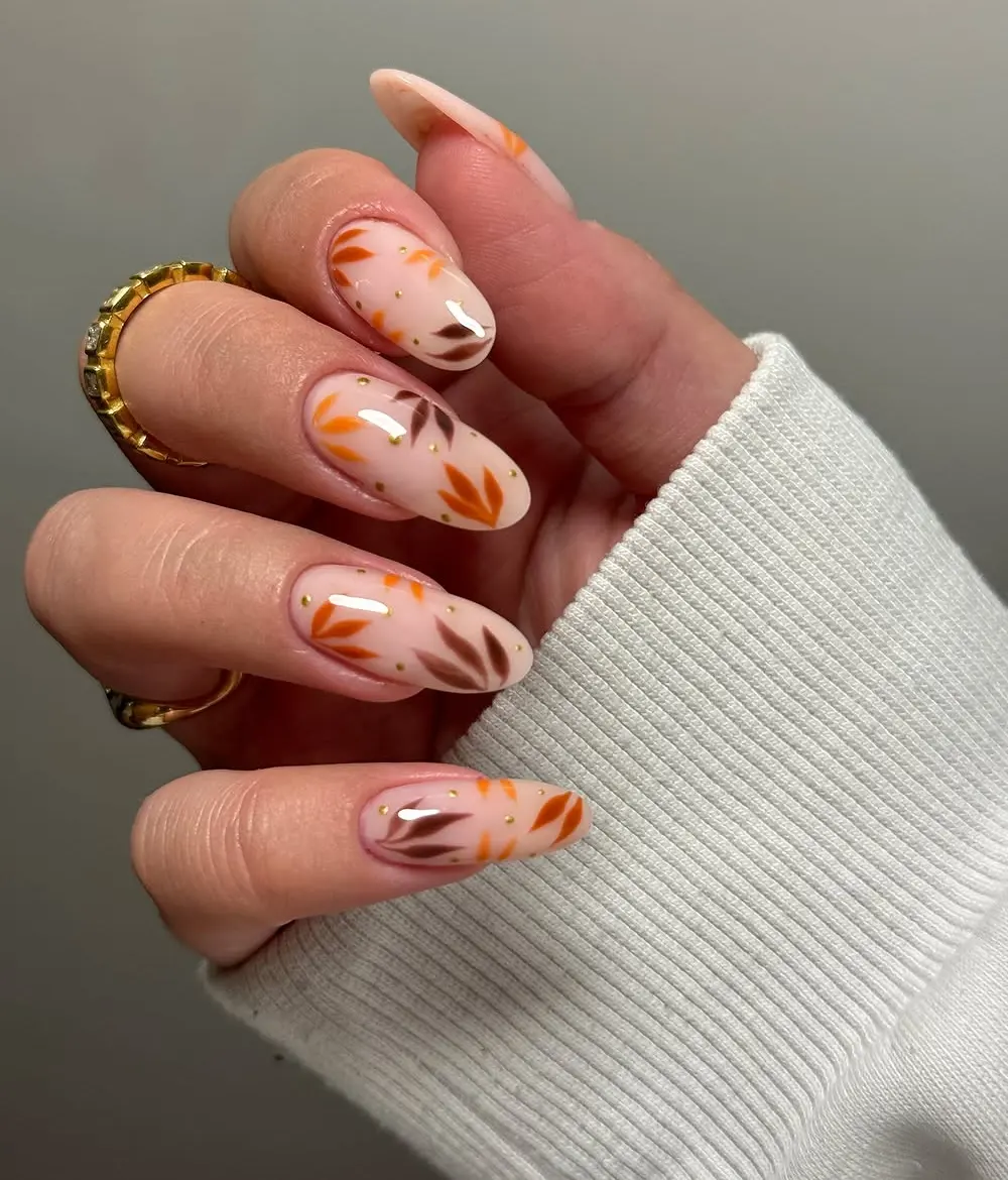 Autumn Leaves in Motion Whimsical Fall Nail Art with Flowing Elegance