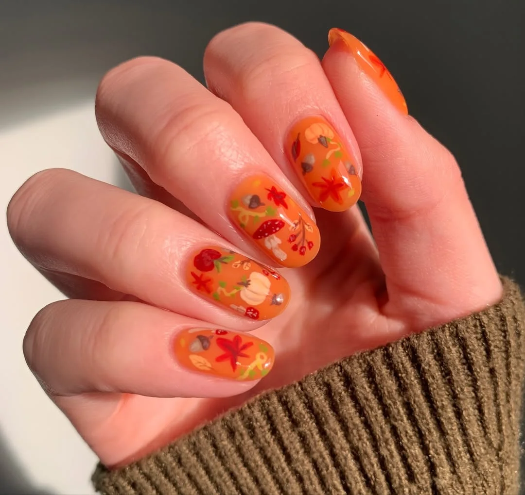 Autumnal Orange Nails with Enchanting Details