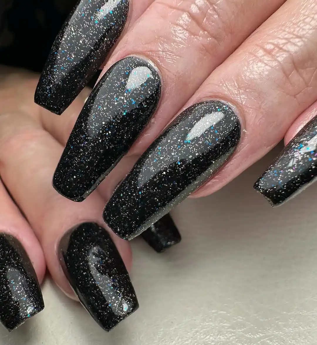 Cosmic Black Nails with a Celestial Sparkle