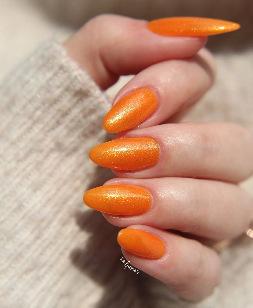 Luminous Orange Nails for Bold Elegance