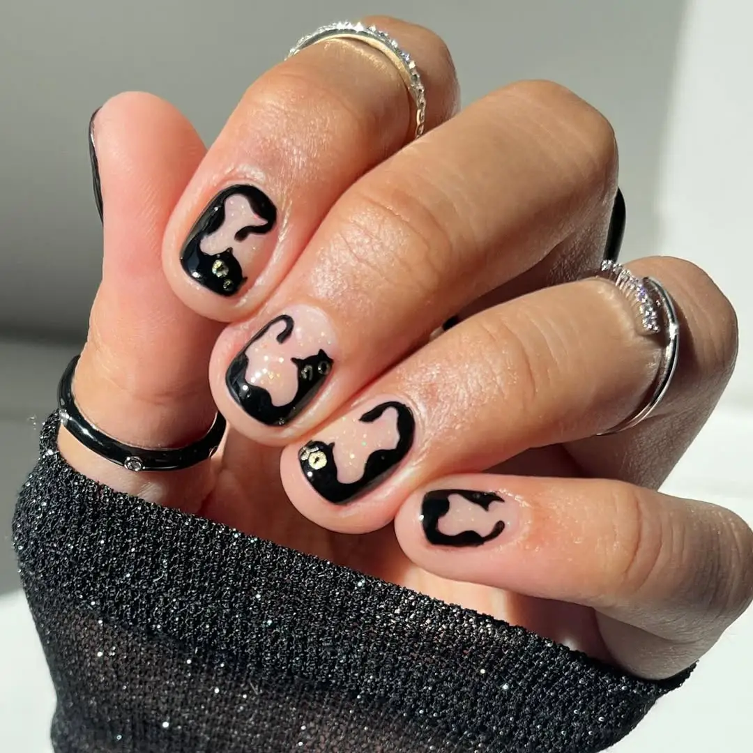 Playful Abstracts: Black and White Nail Art for Short Nails