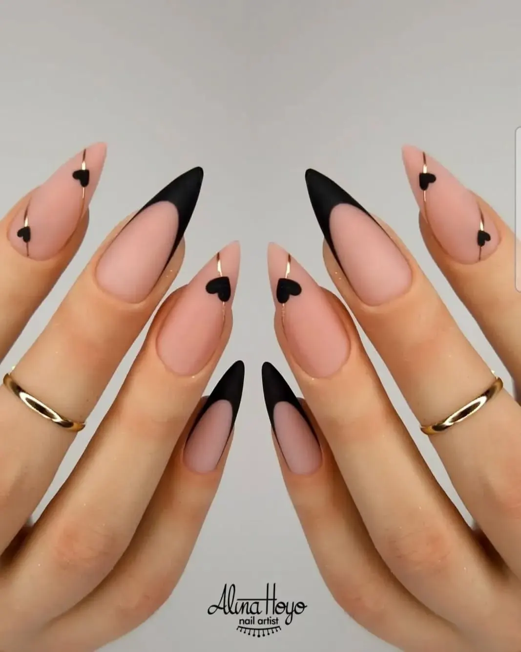 Sleek Romance: Black and Nude Heart-Tipped Nail Design