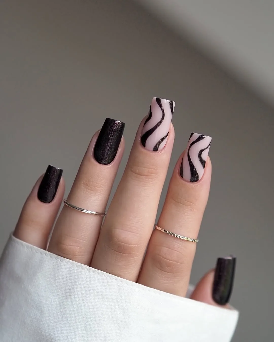 Subtle Swirls Black and White Nails with a Modern Twist