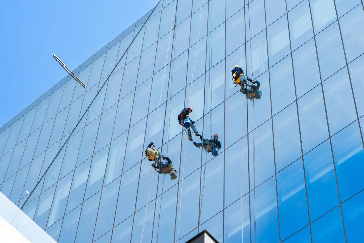 Window cleaners using rope access