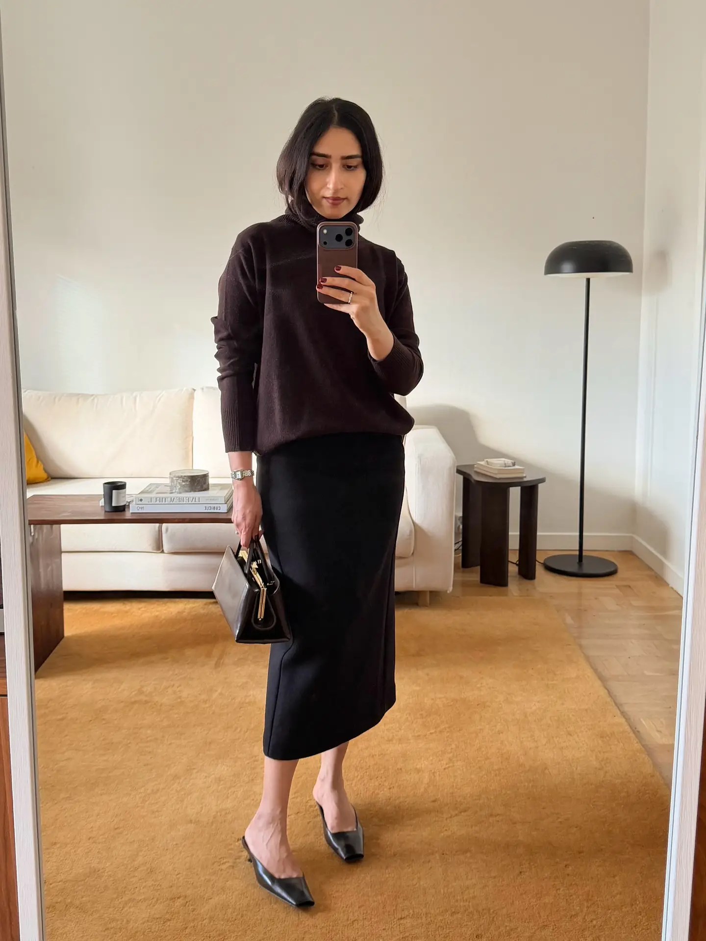Chocolate Turtleneck With a Black Midi Skirt