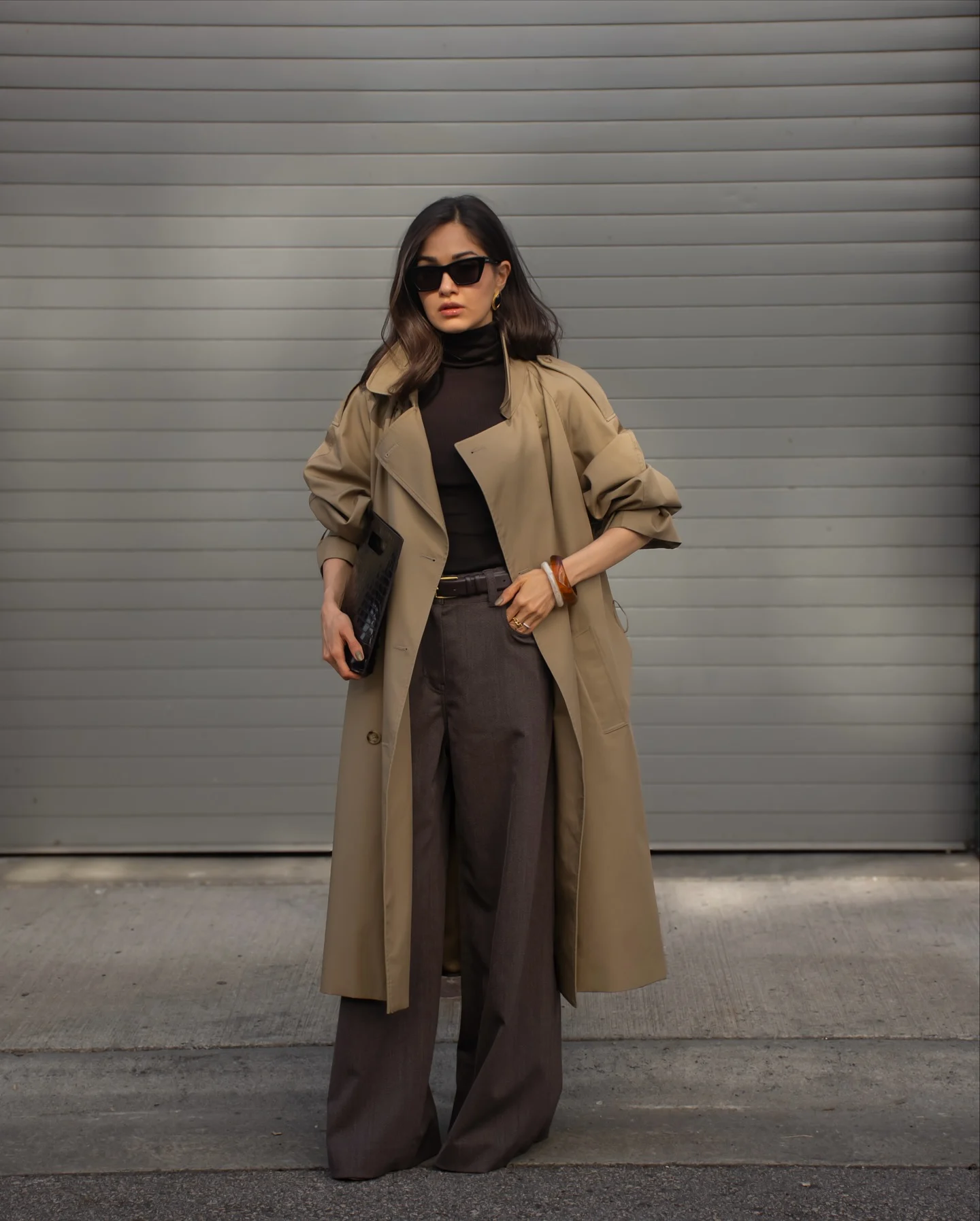 Dark Layers Under a Trench Coat Create a Sleek Fall Outfit