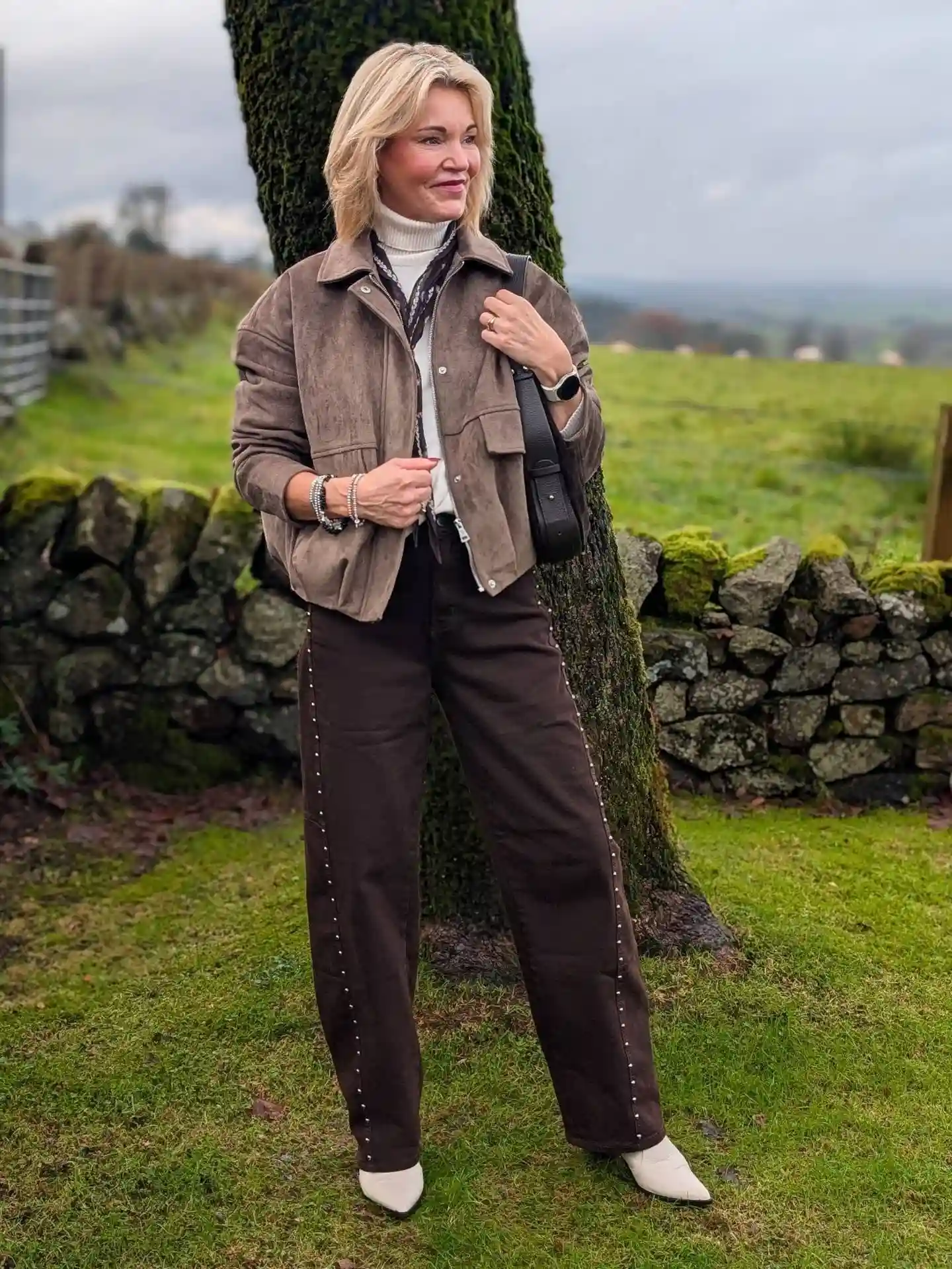 Tonal Brown Layers With a Cream Turtleneck