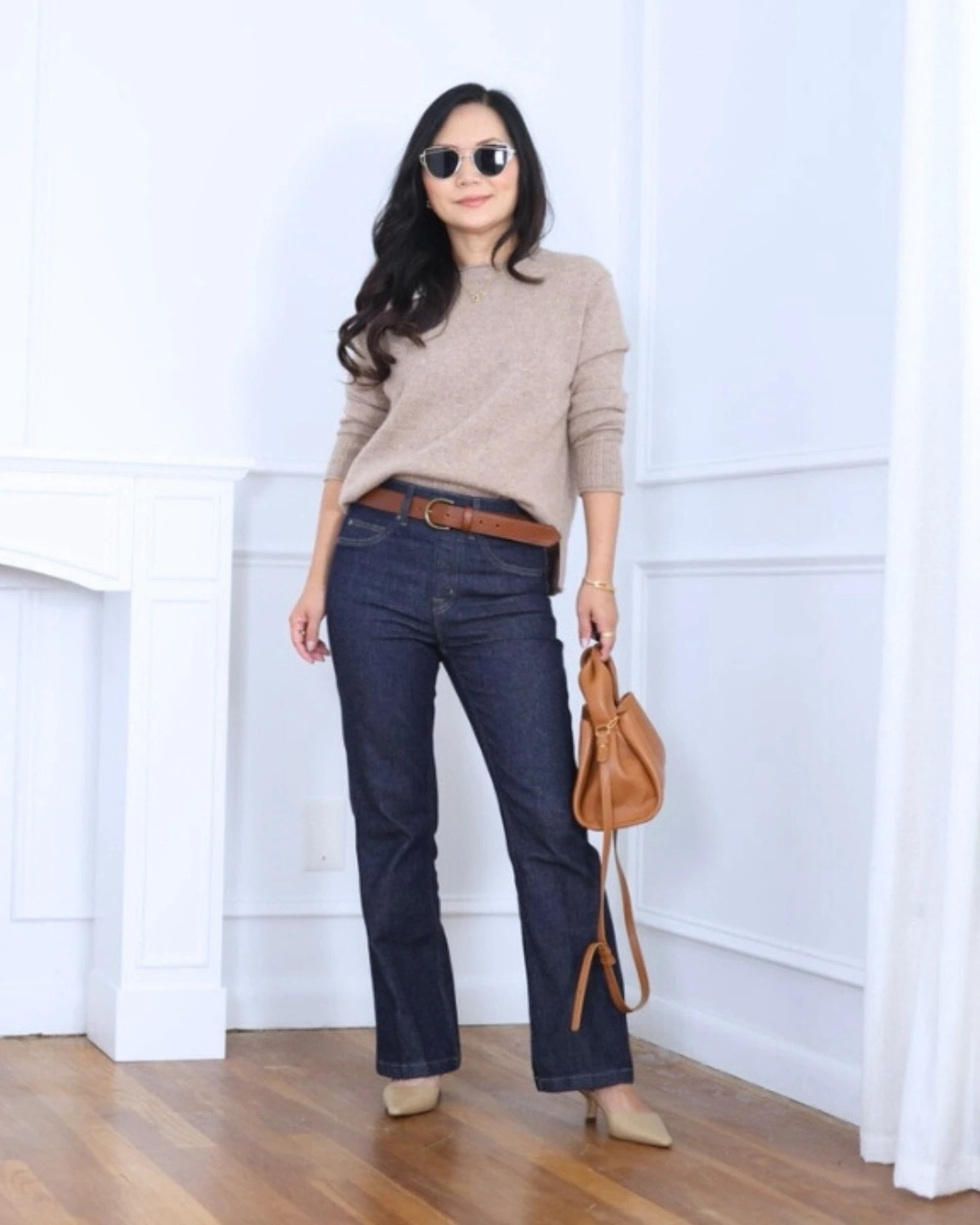 Dark Straight-Leg Jeans and a Soft Sweater Create a Longer Line