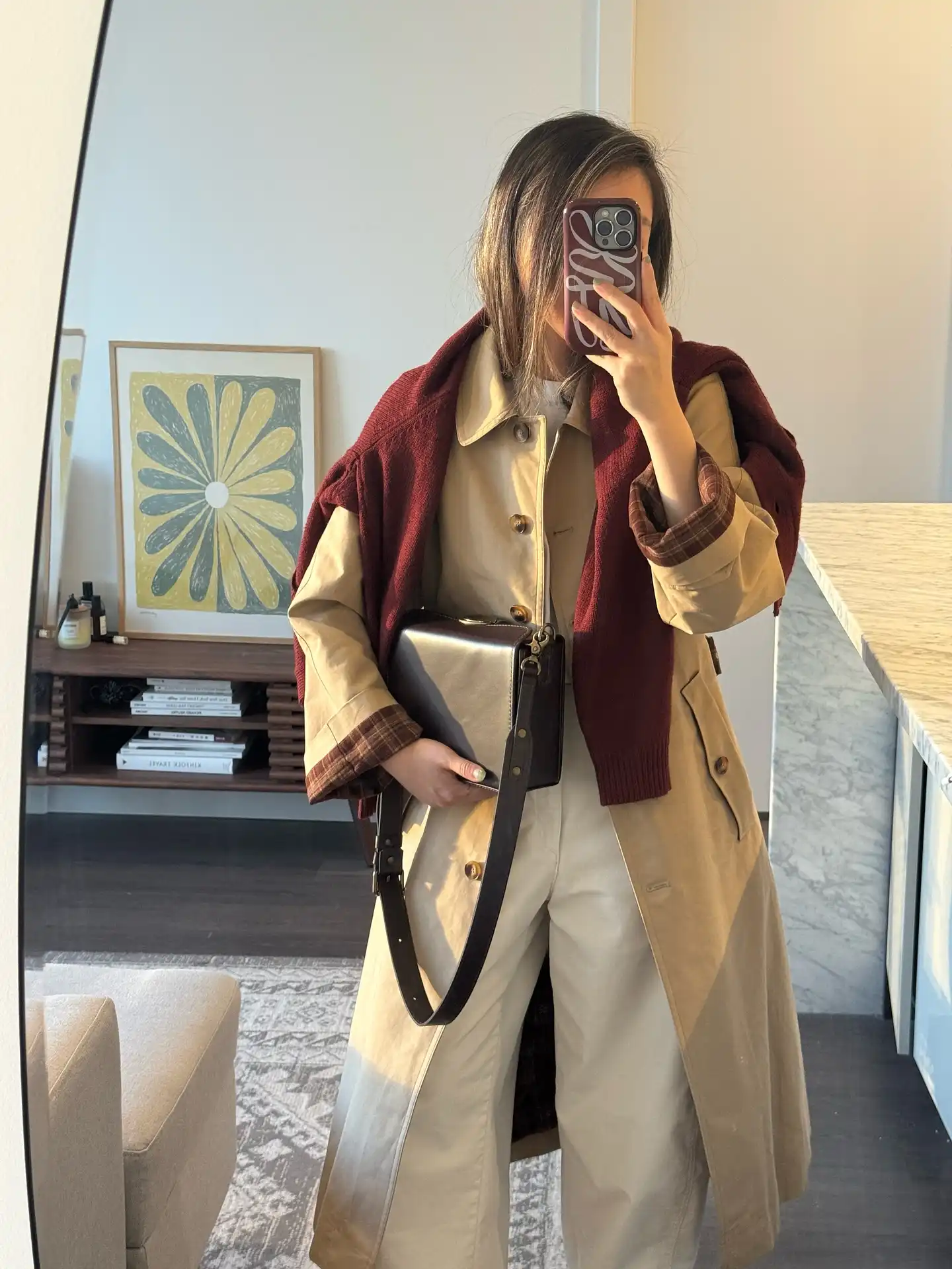 Drape a Knit Over a Trench for a Flexible Extra Layer