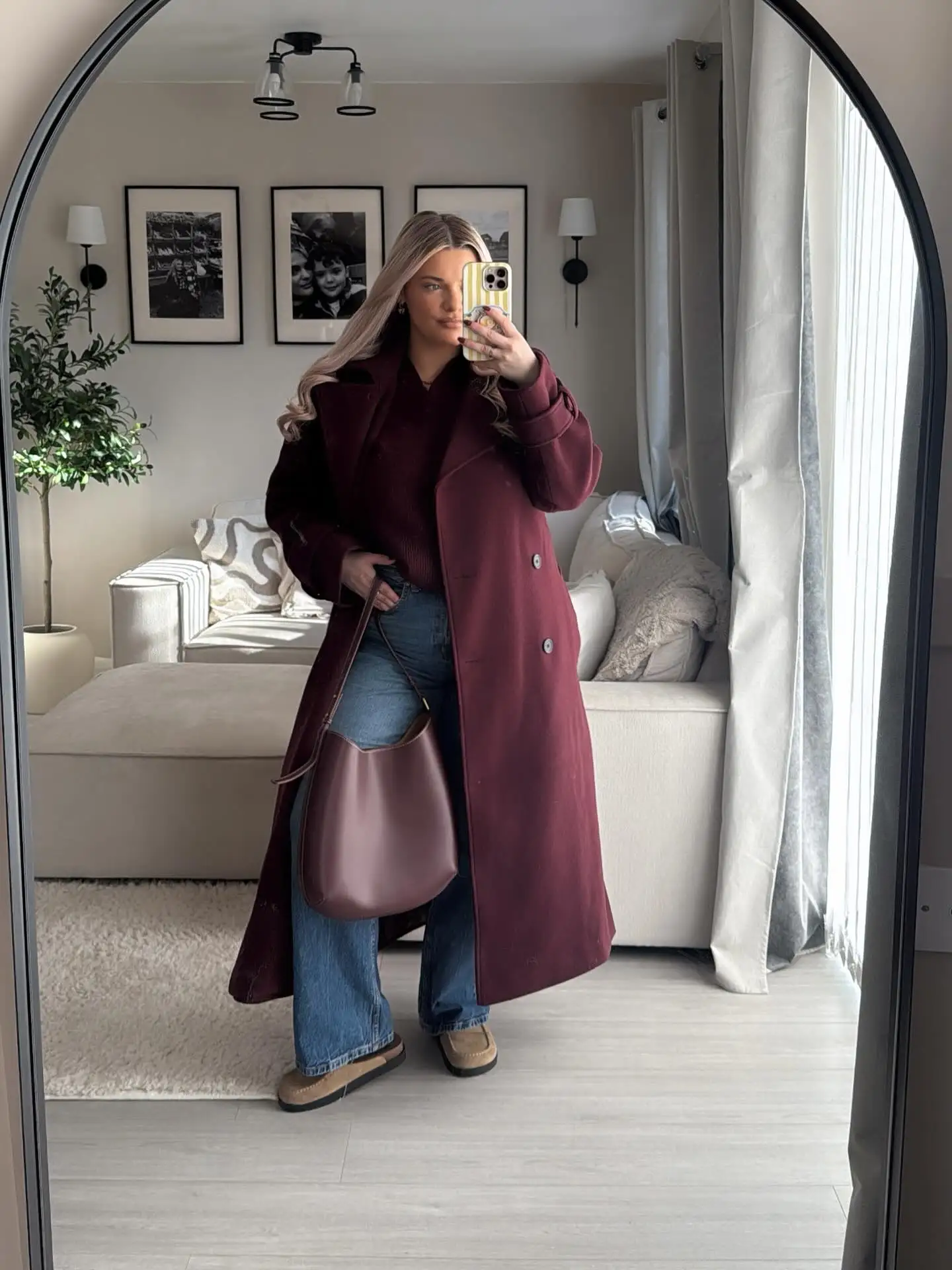 Style a Burgundy Coat With Straight Jeans and Cozy Flats
