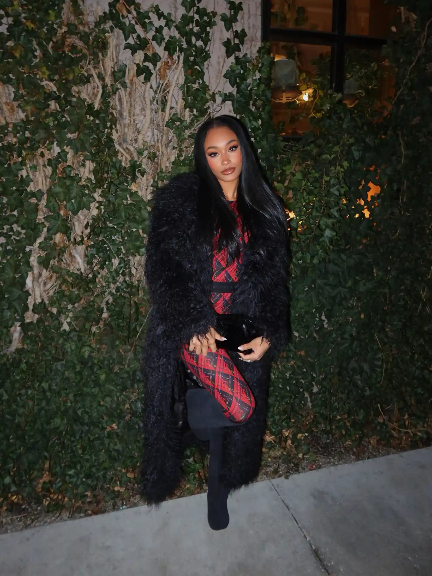 Black Faux-Fur Coat With a Red Plaid Dress