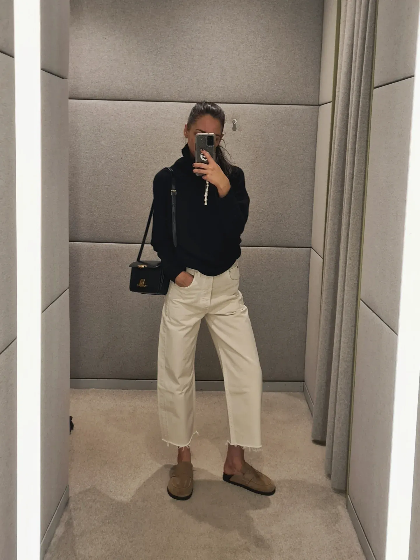 Black Turtleneck With Cream Cropped Trousers and Loafers