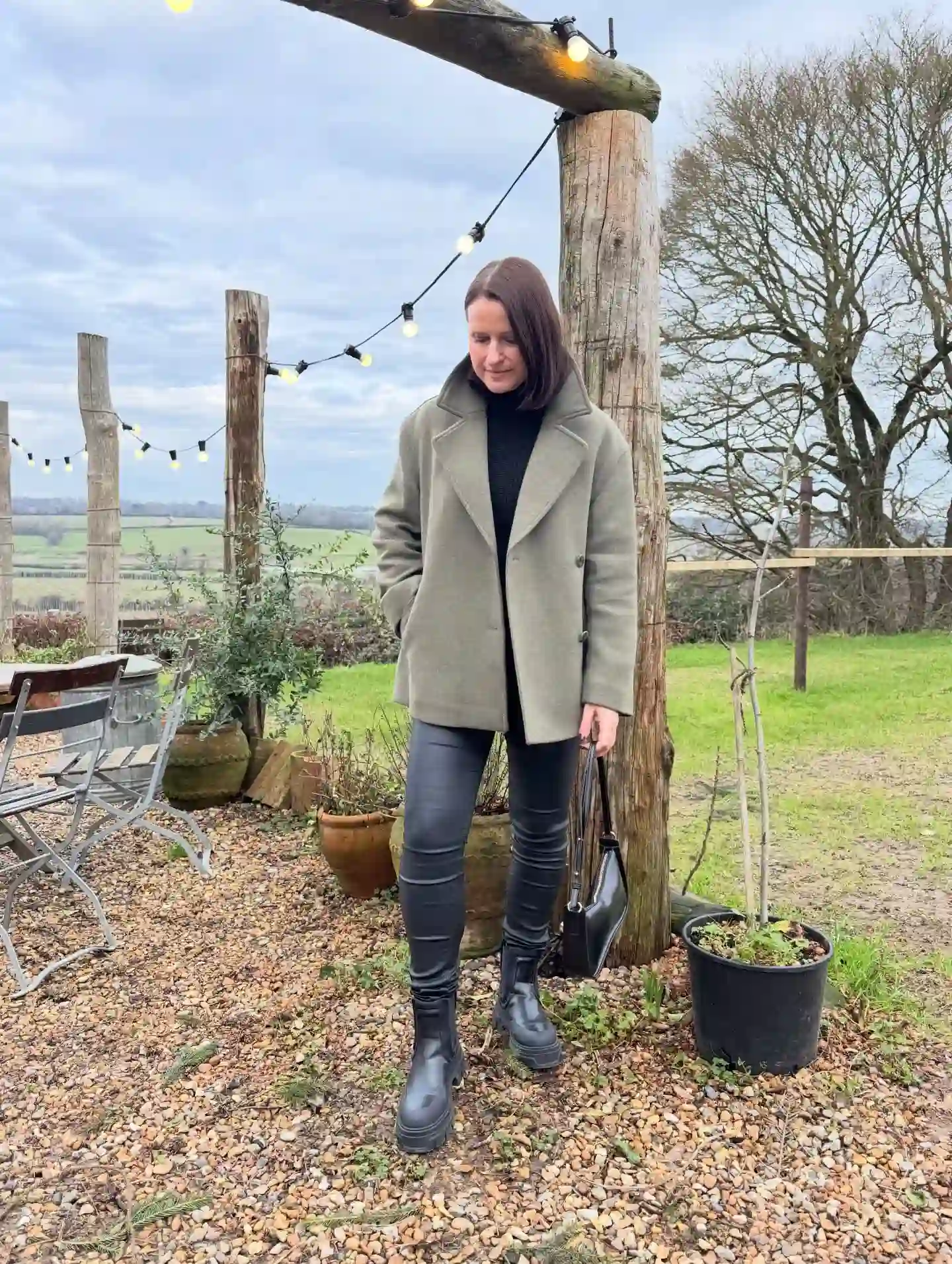 Olive Coat With Black Knit and Slim Coated Pants