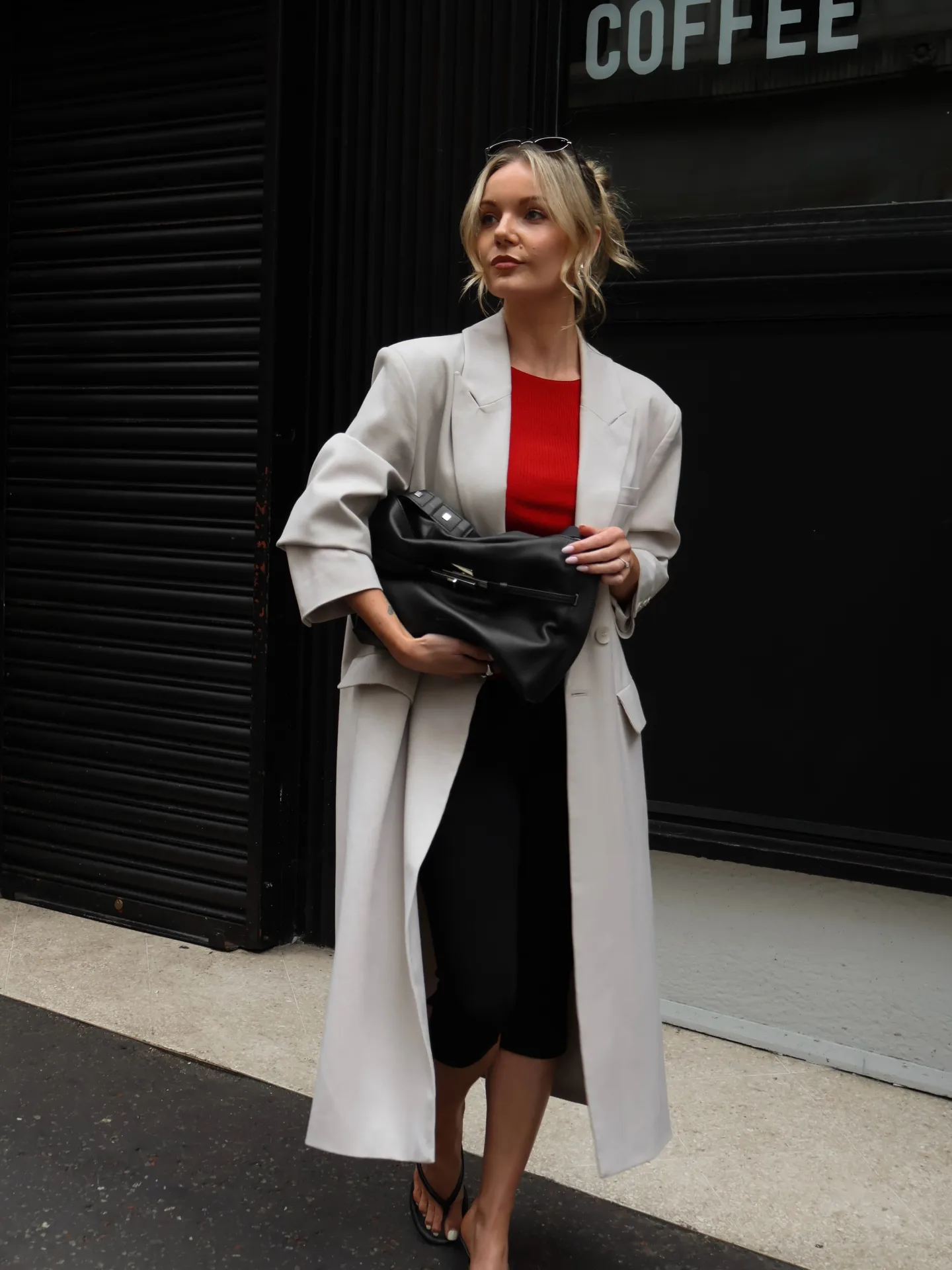Long Neutral Coat With a Bold Red Top