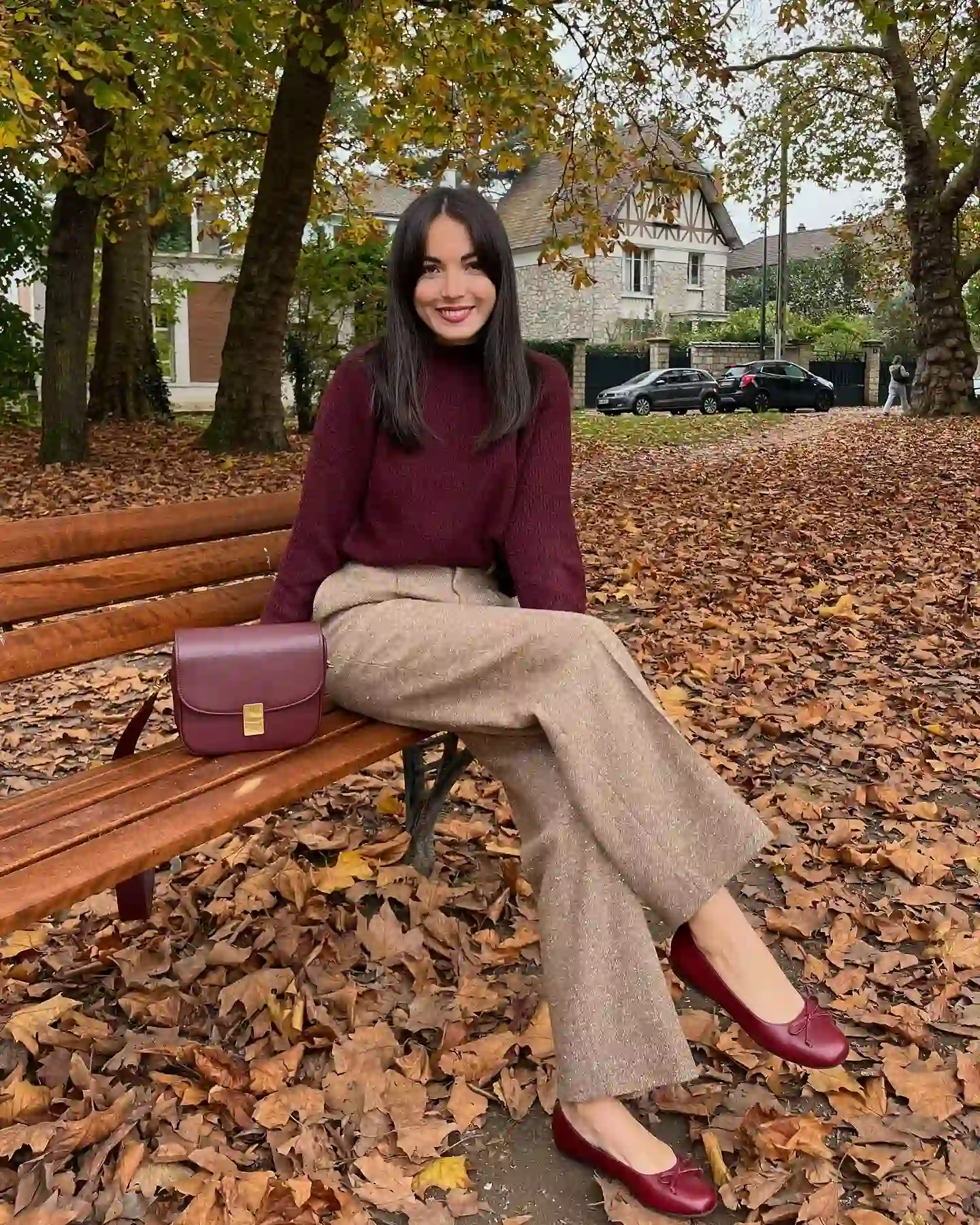 Style a Burgundy Knit With Warm Taupe Trousers