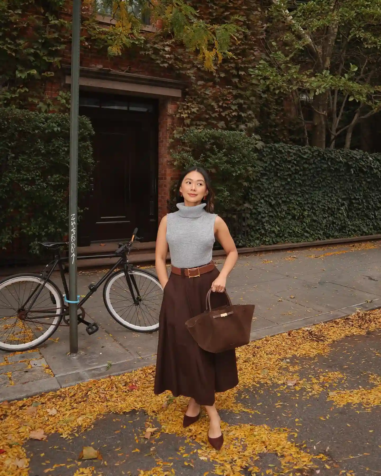 Sleeveless Turtleneck and Midi Skirt Keep Fall Layers Streamlined