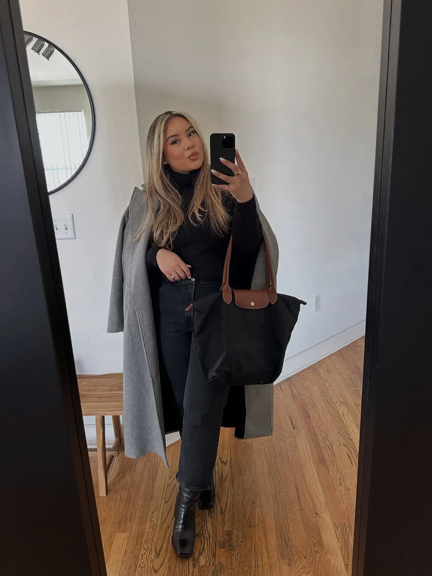 Black Turtleneck With Dark Jeans and a Long Gray Coat