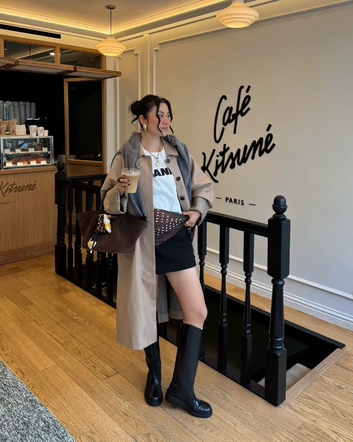 Trench Coat With Mini Skirt And Boots For A Chic Fall Coffee Look