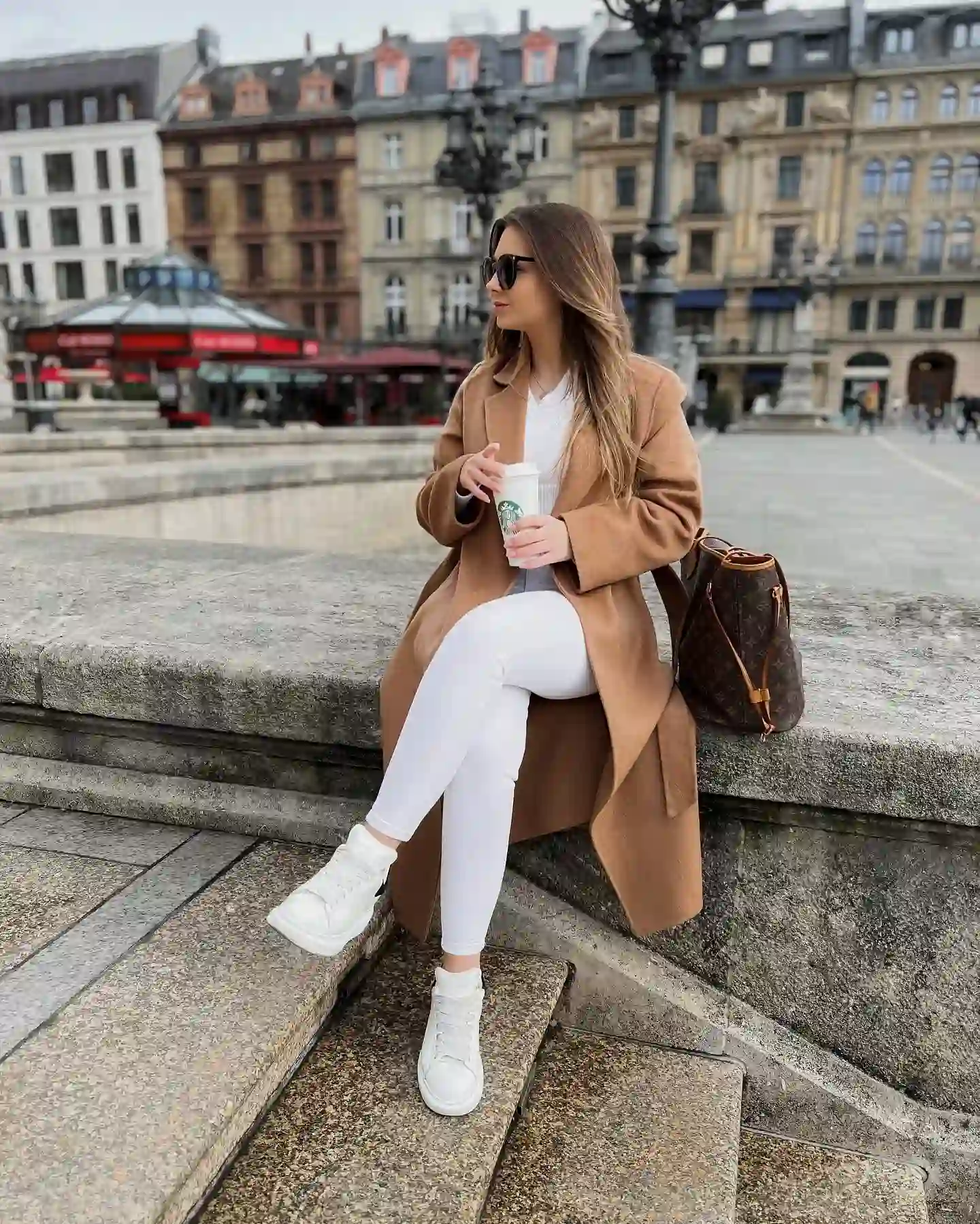 Long Camel Coat With White Jeans and Sneakers